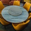 Elegant Circular Stone Table with Leather Chairs