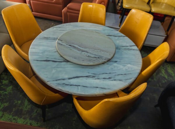 Elegant Circular Stone Table with Leather Chairs