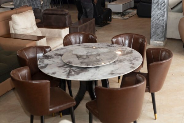Rounded Stone Table with Premium Leather Chairs
